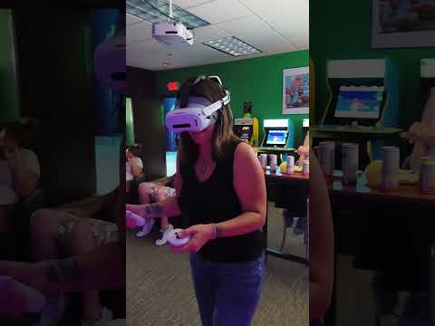 An adult guest enjoying a VR game