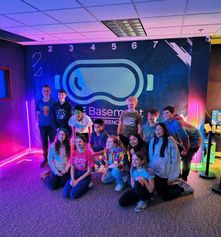 A birthday group posing together at The Basement VR